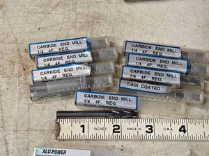 lot 204 image: Lot of (9) 14 4 Flute End Mill Bits (in original packaging)