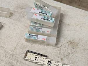 lot 206 image: Lot of (9) 18 3 Flute End Mill Bits (in original packaging)