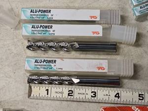 lot 207 image: (2) 12 3 Flute End Mill Bits and (1) 716 3 Flute End Mill Bits (in original packaging)