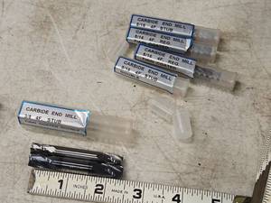 lot 208 image: 4 Flute Double Ended End Mill Bits - (4) 516 and (1) 38 (in original packaging)