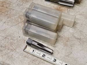 lot 243 image: Lot of (6) 14-18 NPT 4 Flute Pipe Taps (in original packaging)