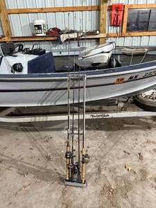 lot 105 image: FISHING RODS AND HOLDER.