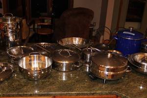 lot 93 image: Large Assorted Stainless Steel and Enamel Cookware Set with Roasters, Pots, Pans, and Steamers