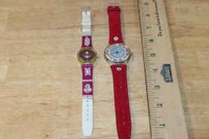lot 112 image: Set of 2 Swatch Watches including Lady Red Swatch and ROI Soleil