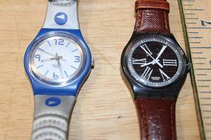lot 113 image: Swatch Solar Sign of Times SRM100 and Access SKS100 Watches Set