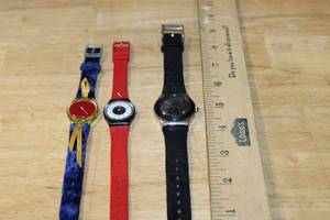 lot 129 image: Set of 3 Swatch Watches Including Black Flower Design