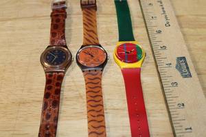 lot 138 image: Set of 3 Swatch Skin Print Watches Assorted Designs
