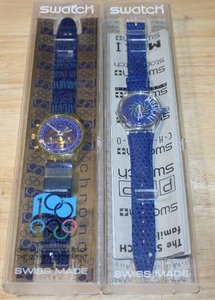 lot 196 image: Set of 2 Swatch Watches - IOC Chronograph SCZ101 and Musicall Tone in Blue SLK100