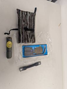 lot 26AM image: Trophy Hunter Deer Call, Realtree Camo Bag, Ameristep Bow Holder, Hunting Accessories