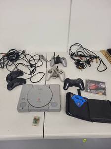 lot 31J image: Sony PlayStation SCPH-5501 Console Lot with Controllers, Memory Card, and Games