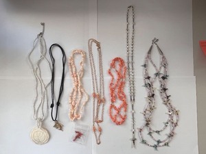 lot 166W image: Collection of 7 Vintage Beaded and Shell Necklaces with Religious and Animal Charms