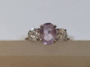 lot 16W image: Elegant Ring with Purple Gemstone and Clear Stones