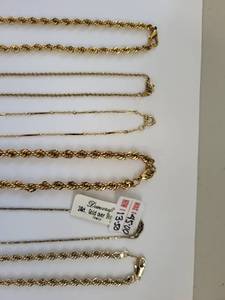 lot 89W image: Collection of Gold Plated Necklaces and Bracelets with Decorative Accents