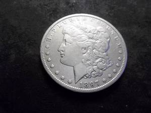 lot 16 image: 1897 O Morgan Silver Dollar