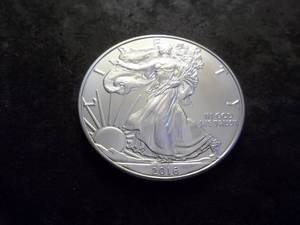 lot 31 image: 2016 Silver Eagle One Dollar 1 OZ. Fine In MS From UNC Roll.