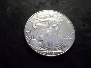 lot 32 image: 2016 Silver Eagle One Dollar 1 OZ. Fine In MS From UNC Roll.