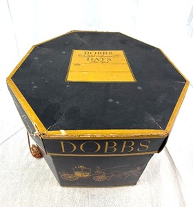 lot 81 image: Dobbs Hats Hat Box - Octagonal Black & Gold with Brown Cord