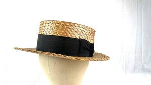 lot 106 image: Gold Metallic Straw Boater Hat & Black Ribbon, Size 7 14