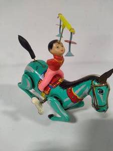 lot 12 image: Acrobat on Horse Wind Up Toy