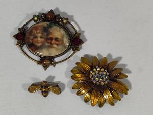 lot 64 image: Sweet Romance Stamped Brooches