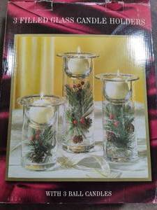 lot 99 image: Three Filled Glass Candle Holders