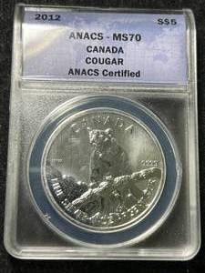 lot 47 image: 2012 CANADIAN COUGAR 1 TROY OZ .9999 FINE SILVER ANACS MS70