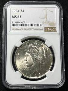 lot 52 image: 1923 US PEACE SILVER DOLLAR NGC MS62