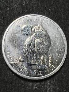 lot 57 image: 2011 CANADIAN WOLF 1 TROY OZ .9999 FINE SILVER
