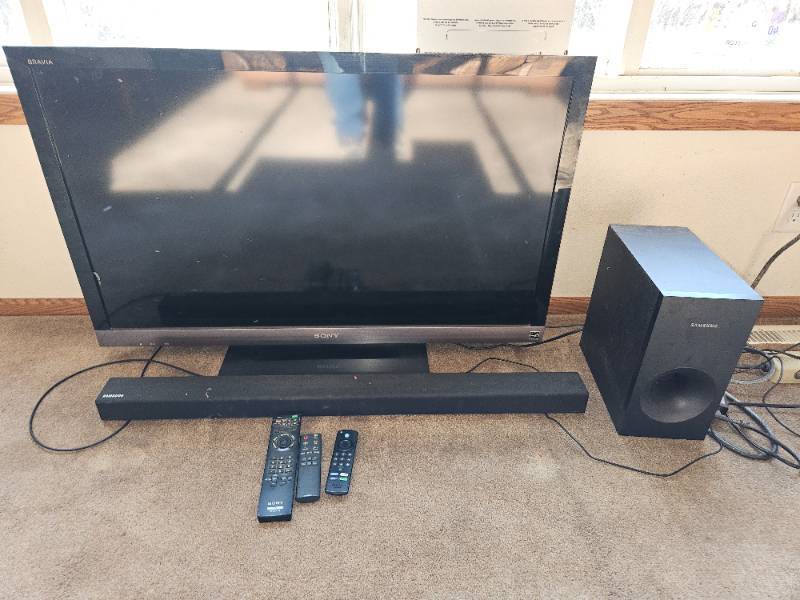 lot 297 image: Sony 42 in. TV With Samsung Sound Bar.