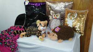 lot 186 image: Official Girl Scout Prize Plushies, Sequin Sensory pillows and More.