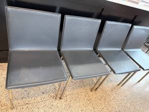 lot 12 image: Set of 4 Modern Black Faux Leather Side Chairs with Metal Legs