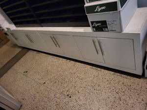 lot 64 image: Two Long White Storage Cabinet with Multiple Doors and Metal Handles