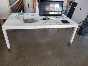 lot 105 image: White Rolling Work Table with Casters and Cable Management Ports