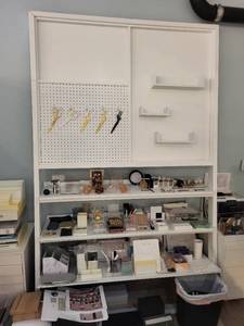 lot 132 image: White Wall-Mounted Pegboard Organizer with Shelves and Scissors Holders