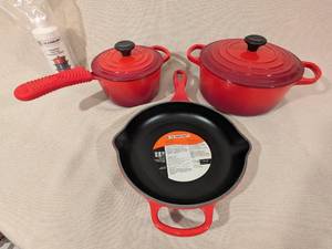 lot 8 image: Le Creuset 5-Piece Enameled Cast Iron Cookware Set Red