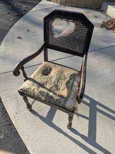 lot 50 image: Vintage Wooden Armchair with Damaged Upholstery and Cane Back