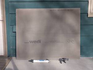 lot 51 image: Wedi 4x5 ft Waterproof Board with Adhesive Gun
