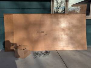 lot 52 image: Lot of 2 Large 4x8 Pegboard Sheets with Over 100 Metal Peg Hooks