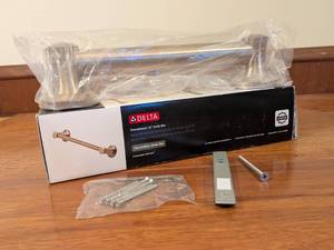 lot 72 image: Delta Transitional 12 Inch Decorative Grab Bar Champagne Bronze Open Box