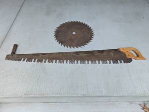 lot 185 image: Vintage Crosscut Saw with Wooden Handles and Large Circular Saw Blade