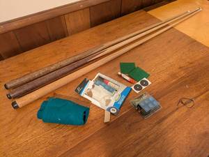 lot 203 image: Set of 3 Pool Cues with Chalk, Table Cloth, and Repair Kit
