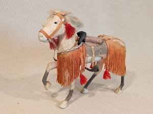 lot 248 image: Vintage Horse Figurine with Ornate Saddle and Tassel Details
