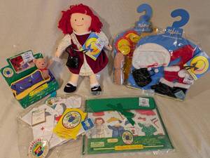 lot 259 image: Madeline Doll with Outfits, Accessories, and Magnetic Doll Set Collection