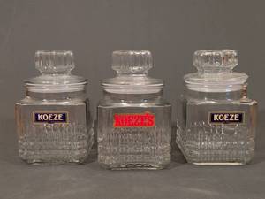 lot 107 image: Set of 3 Koeze Glass Candy Jars with Lids