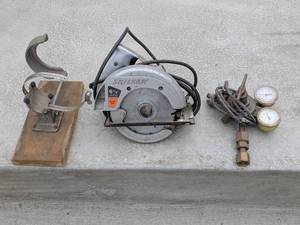 lot 149 image: Skilsaw 6-12 Inch Circular Saw, Vintage Victor Regulator, and Pipe Clamp Set