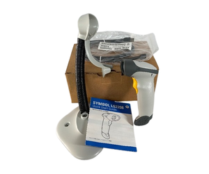 lot 92 image: MSRP $250  NEW in box Symbol LS2208 Barcode Scanner & Stand Lightning-fast 1D laser scanning with a lightweight, ergonomic design for all-day comfort. Perfect for retail, healthcare, or education. Scans up to 17 away.