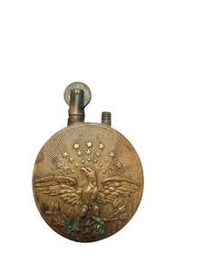 lot 182 image: Antique Brass Poilu Pocket Lighter with Eagle and Shield Motif
