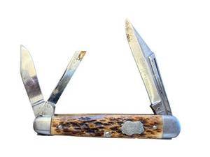 lot 268 image: Schrade Walden USA Three-Blade Pocket Knife with Jigged Bone Handle