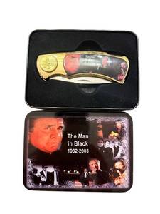 lot 307 image: Johnny Cash The Man in Black Collectible Pocket Knife with Tin Case