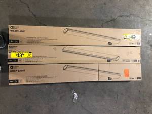 lot 39 image: Lot of 3 Commercial Electric 1-Pack 4 ft. 3600 Lumens LED Ceiling Wraparound Light 120V Hardwire Garage Laundry Room Shop Light Bright White 4000K customer return see pictures